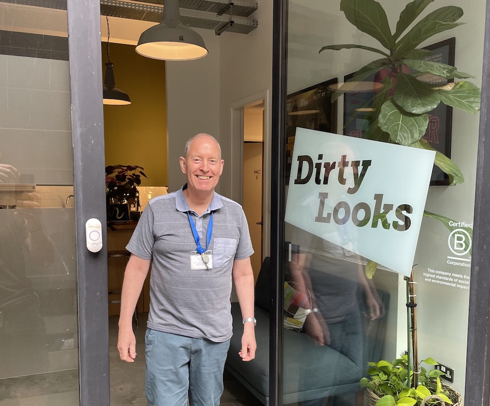 An image showing the owner of the business Dirty Looks outside his shop after our successful Central London waste collection and disposal project.